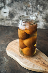 Pickled lemon on rustic background