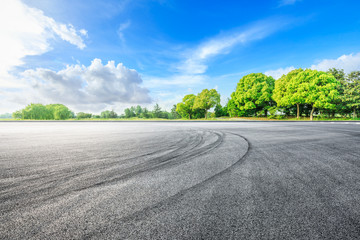 Asphalt race track ground and green woods in the countryside nature park