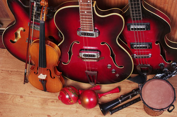 Obraz na płótnie Canvas Three electric guitars, violin, maracas, djembe