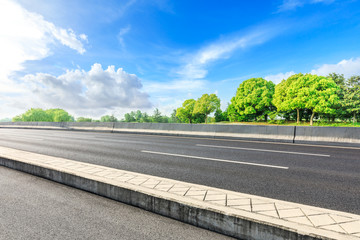 Asphalt road and green woods in the countryside nature park © ABCDstock