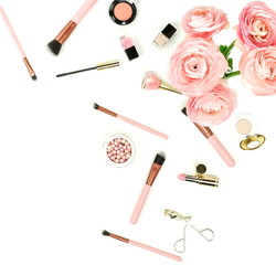 Makeup cosmetic accessories products  top view brushes, lipstick, pink flowers ranunkulus  on white background. Flat lay. Copy space