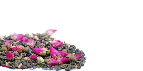 green tea. green tea with flowers and fruit pieces. blend tea isolated on a white. copy spaces.