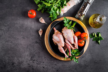 Raw uncooked quail. Ingredients for cooking healthy meat dinner. Top view