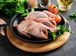 Raw uncooked quail. Ingredients for cooking healthy meat dinner.