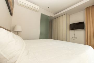 White bedding and pillow in hotel room, pillows on the bed, two pillows in hotel, bed in hotel, bed white color, pillows white color, hotel vintage