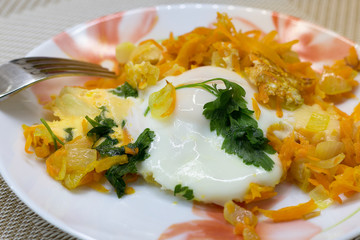 Home lunch of scrambled eggs, vegetables, cheese and parsley