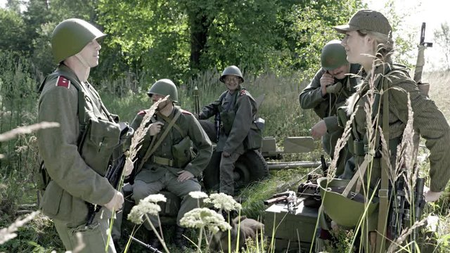 Soldiers talking and waiting in camp near frontline