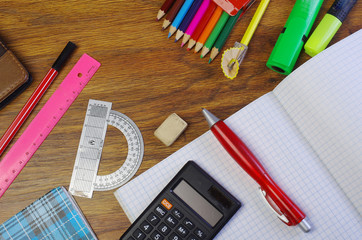 Getting ready for school. School stationery on a wooden table. 