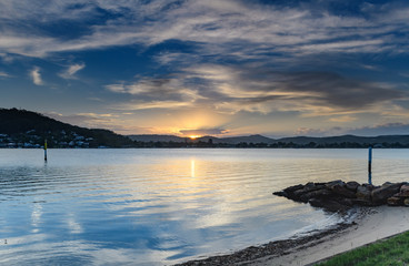 Sunset Bay Waterscape with High Clouds