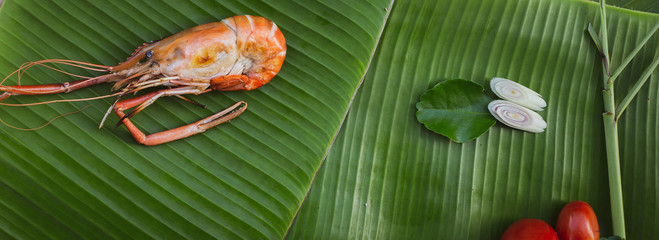 shrimp and vegetables on banana leaf