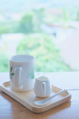hot cup with little jar