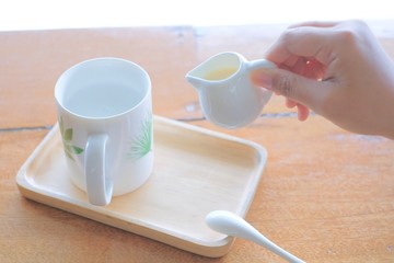 hot cup with little jar