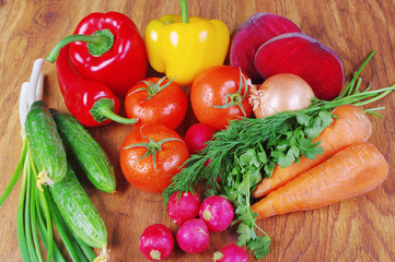 Appetizing vegetables. Tomatoes, radish, carrots, peppers, cucumbers, beet