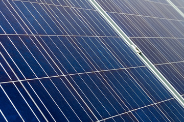 Closeup on solar cell photovoltaic panels at energy production plant