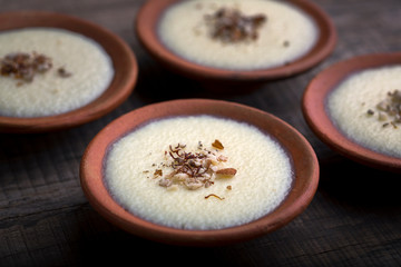 phirni - sweet rice pudding - traditional punjabi sweet dish in earthen plate