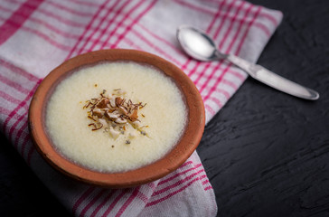 phirni - sweet rice pudding - traditional punjabi sweet dish in earthen plate