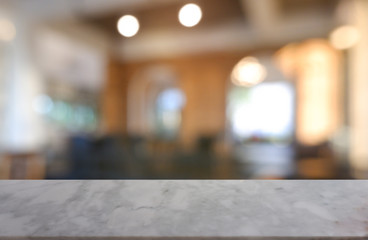 Empty marble stone table in front of abstract blurred background of restaurant, cafe and coffee shop interior. can be used for display or montage your products - Image.