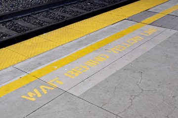 wait behind yellow line