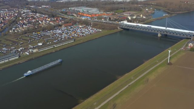 Aerial of the Maxau Rhine Bridge in Karlsruhe far view with boat and bridge together.