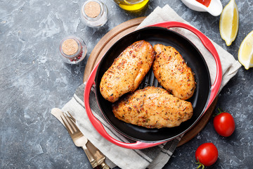 Grilled chicken breast.Grilled chicken breast or fillet on iron pan. 