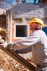 Construction worker on a heavy site doing hard work.