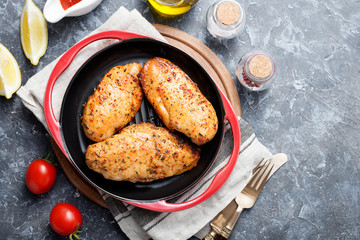 Grilled chicken breast.Grilled chicken breast or fillet on iron pan. 