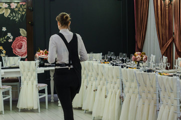 A waiter serving in beautiful banquet hall 