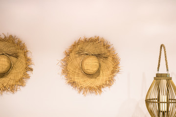 summer hats hanging on the wall