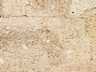 Background image in the form of coarse-grained plaster on the masonry
