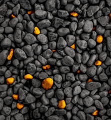gold and black stone background, golden stones in black stone -