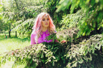 Fairy girl unicorn with pink hair in summer forest