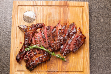 food, delicious, horse meat and craft concept - serving of grilled steak