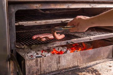 food, delicious and meat dishes concept - Horse sausages prepared on barbeque