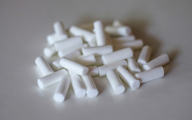 Cigarette filter on white background