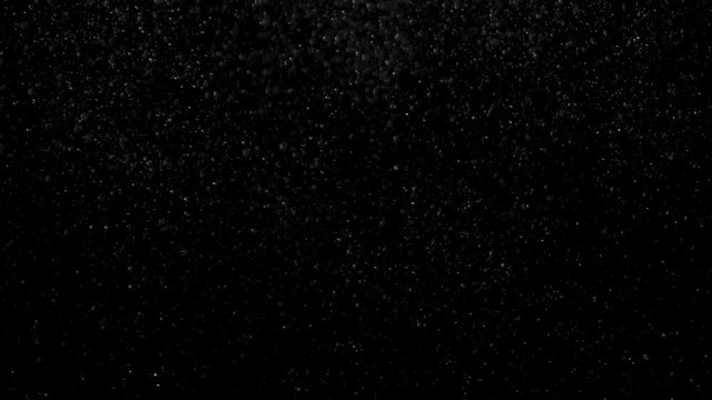 Dust particles floating in the air.light on black curtain with dust floating in front. 4K. Volume Light with Dust Particles