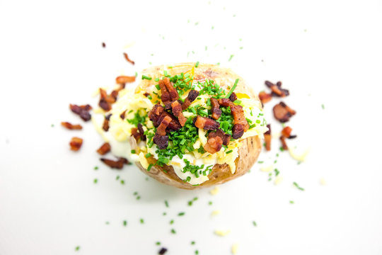 Baked potato with cheese and bacon. Top view