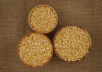 Raw yellow split plate on a burlap texture background