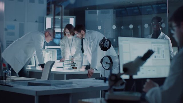 Moving Shot in Industrial Design Laboratory, Specialist Uses Microscope, Designer Works on Personal Computer, Researcher Writes on Glass Whiteboard, Team of Developers Use 3D Printer and Motherboard