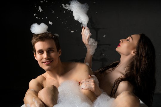 Happy couple having bath together shot