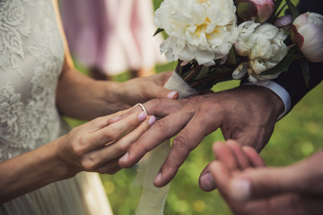 bride and groom holding hands