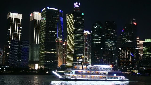 View Of Shanghai Skyline At Night. Huangpu river, Oriental Pearl Tower And City Skyline.