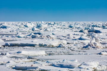 Fototapeta na wymiar Frozen North Atlantic Ocean ice floes covering sea