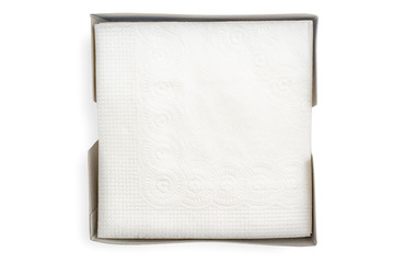 paper napkins in box isolated on white background, top view