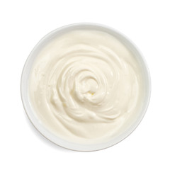 Sour cream in bowl, mayonnaise, yogurt, isolated on white background. Top view.