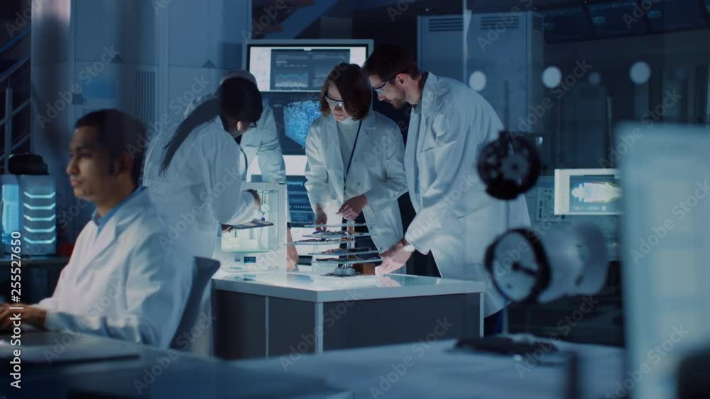 Fototapete In Technology Research Laboratory: Diverse Team of Industrial Scientists, Engineers, Developers Work with Digital Whiteboard Showing Engine Blueprints, Efficiency Calculated by Neural Network