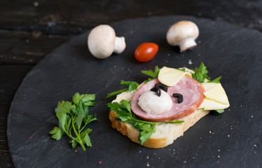 Children's sandwich made in the form of a dog. Option of children's serving