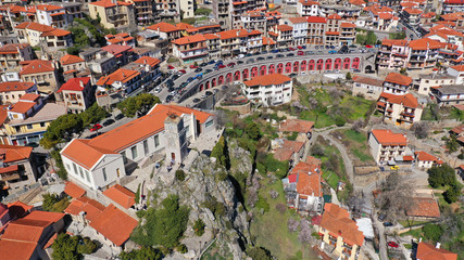 Naklejka premium Aerial drone photo from famous and picturesque village of Arachova built on the slope of Parnassus mountain with traditional character at spring, Voiotia, Greece