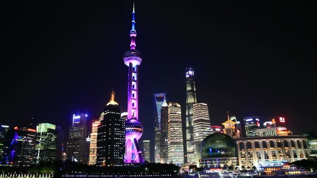 View Of Shanghai Skyline At Night. Huangpu river, Oriental Pearl Tower And City Skyline.
