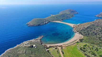 Aerial drone panoramic photo of iconic two sided sandy tropical turquoise sea paradise beach of Kolones near Fykiada in island of Kythnos at spring, Cyclades, Greece