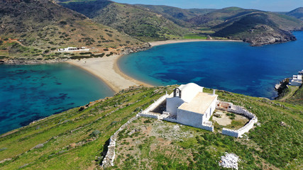 Fototapeta na wymiar Aerial drone photo of picturesque chapel of Agios Loukas and iconic two sided sandy tropical turquoise sea paradise beach of Kolones and Fykiada in island of Kythnos at spring, Cyclades, Greece